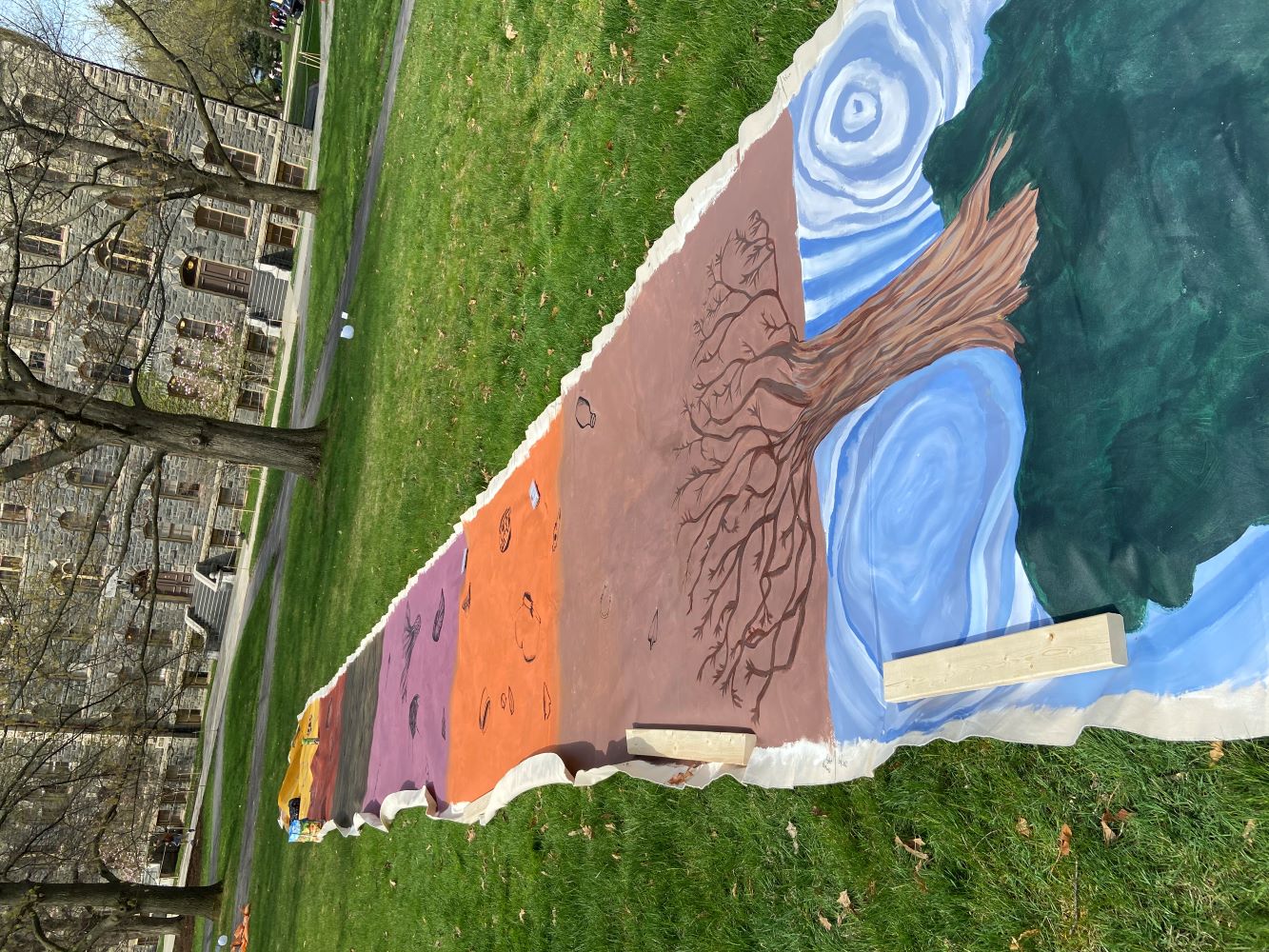view of canvas on the floor laid out before being hung up